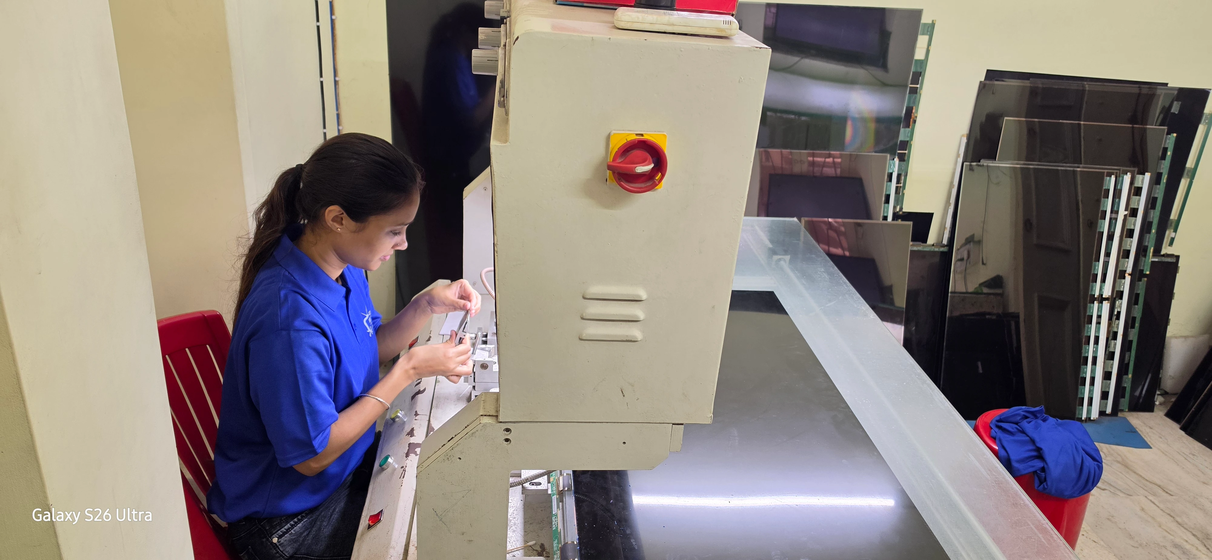 A Technician Repairing a TV at our service center.